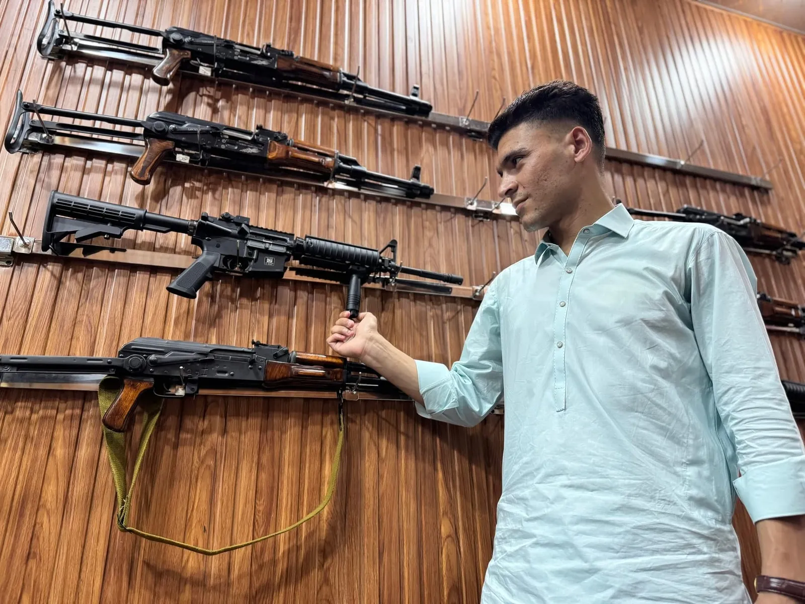 Inside the Target Armoury shop in Darra Adam Khel, with rifles on the display wall