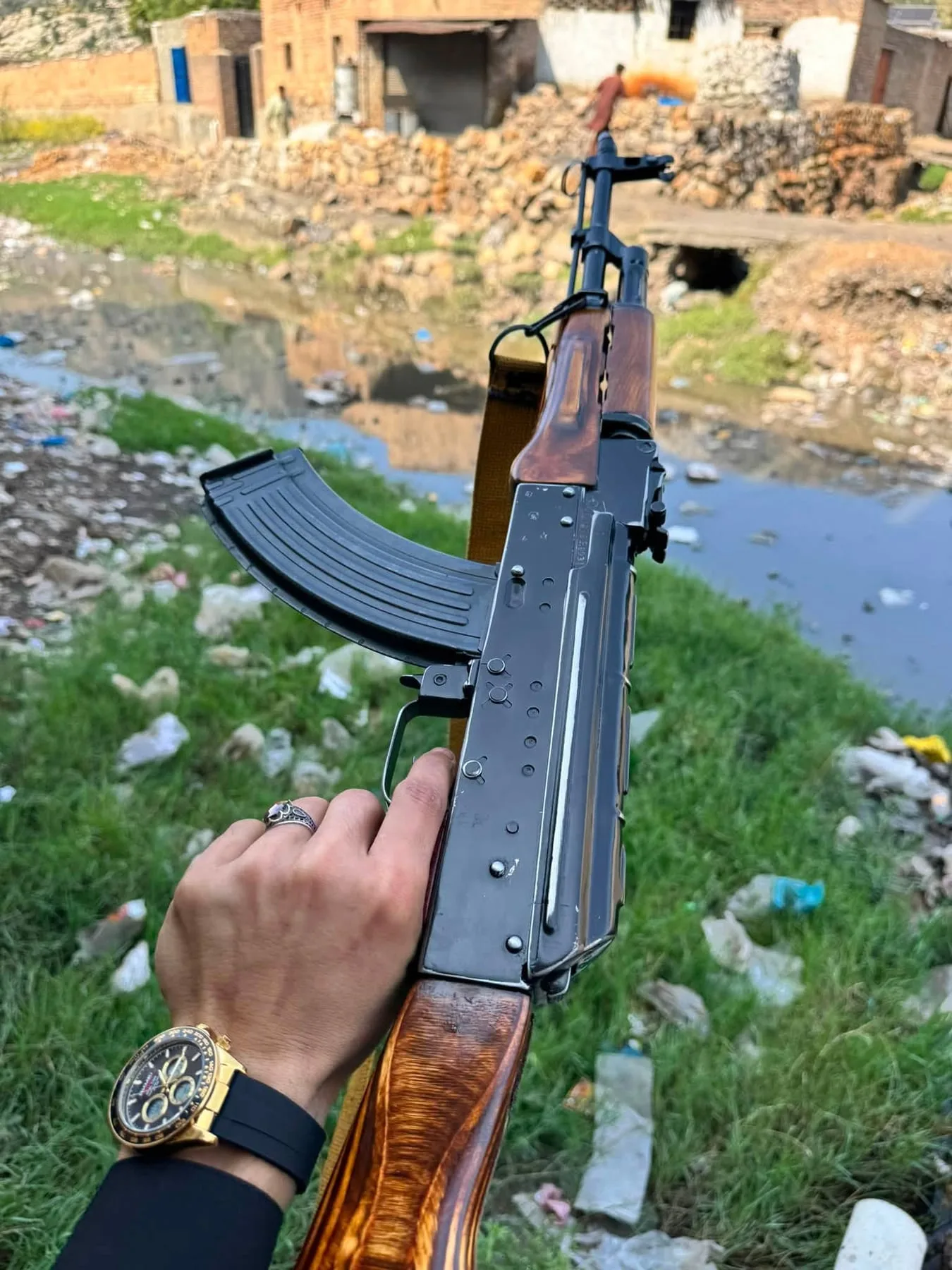 An AK-pattern rifle with wooden furniture