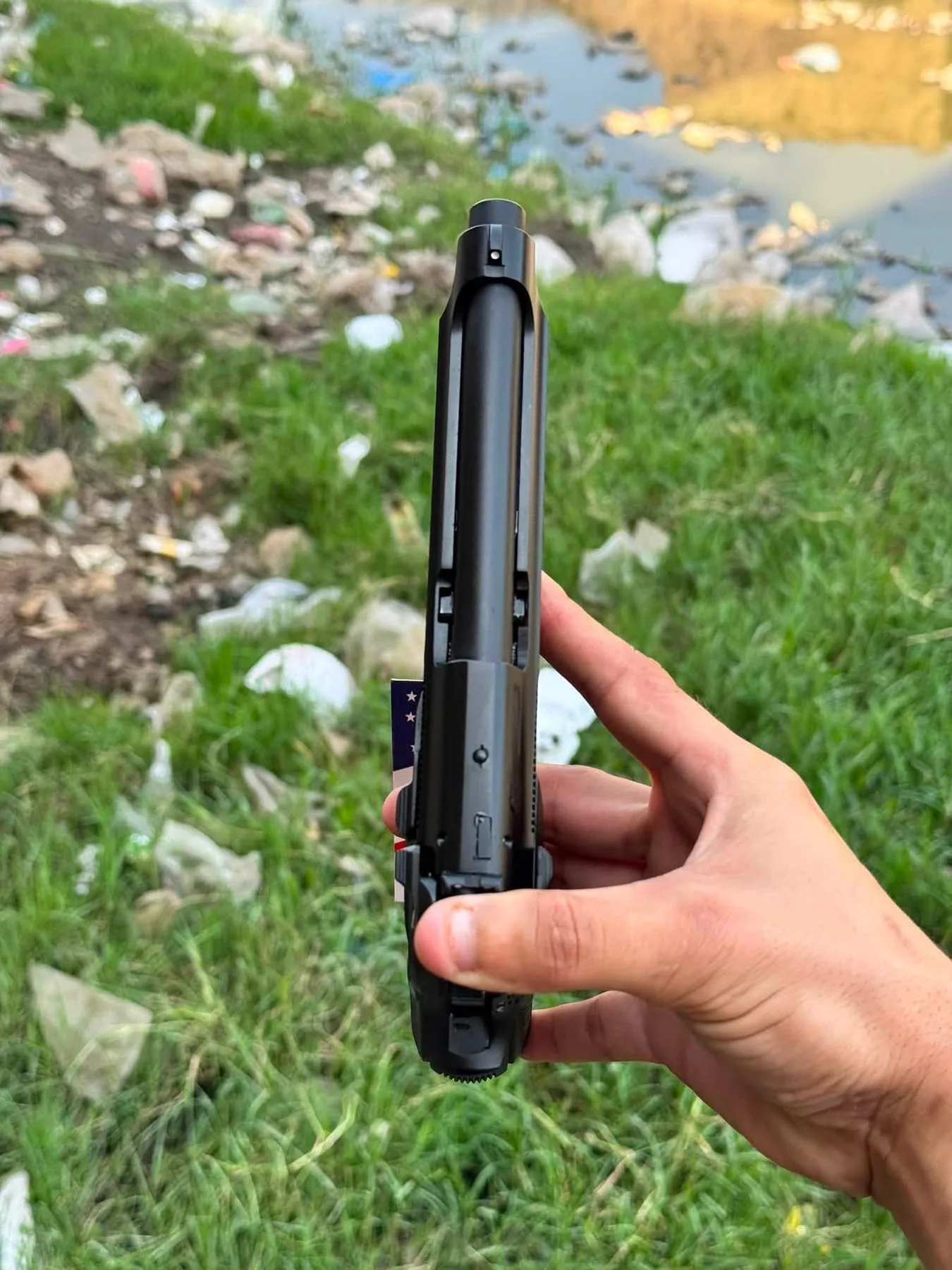 A black pistol held upright